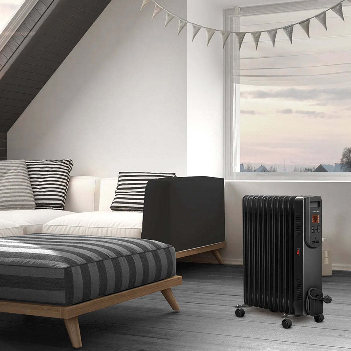 Trotec TRH 25 E zwarte olieradiator in een slaapkamer