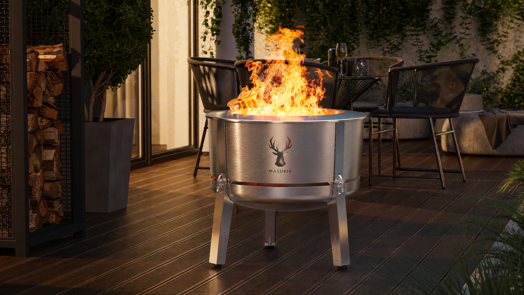 Alpha 800 Silver rookloze vuurkorf op overdekt terras in avondsfeer met vlam
